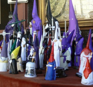 Not the Klan: figurines of hooded Lenten penitents in an Oviedo shop window